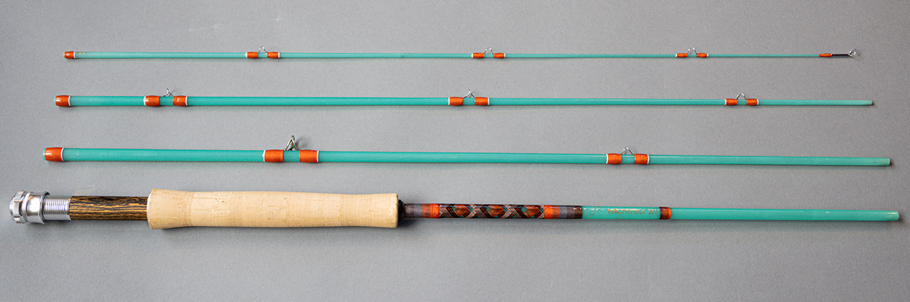 Fly rod in pieces; orange and white guides